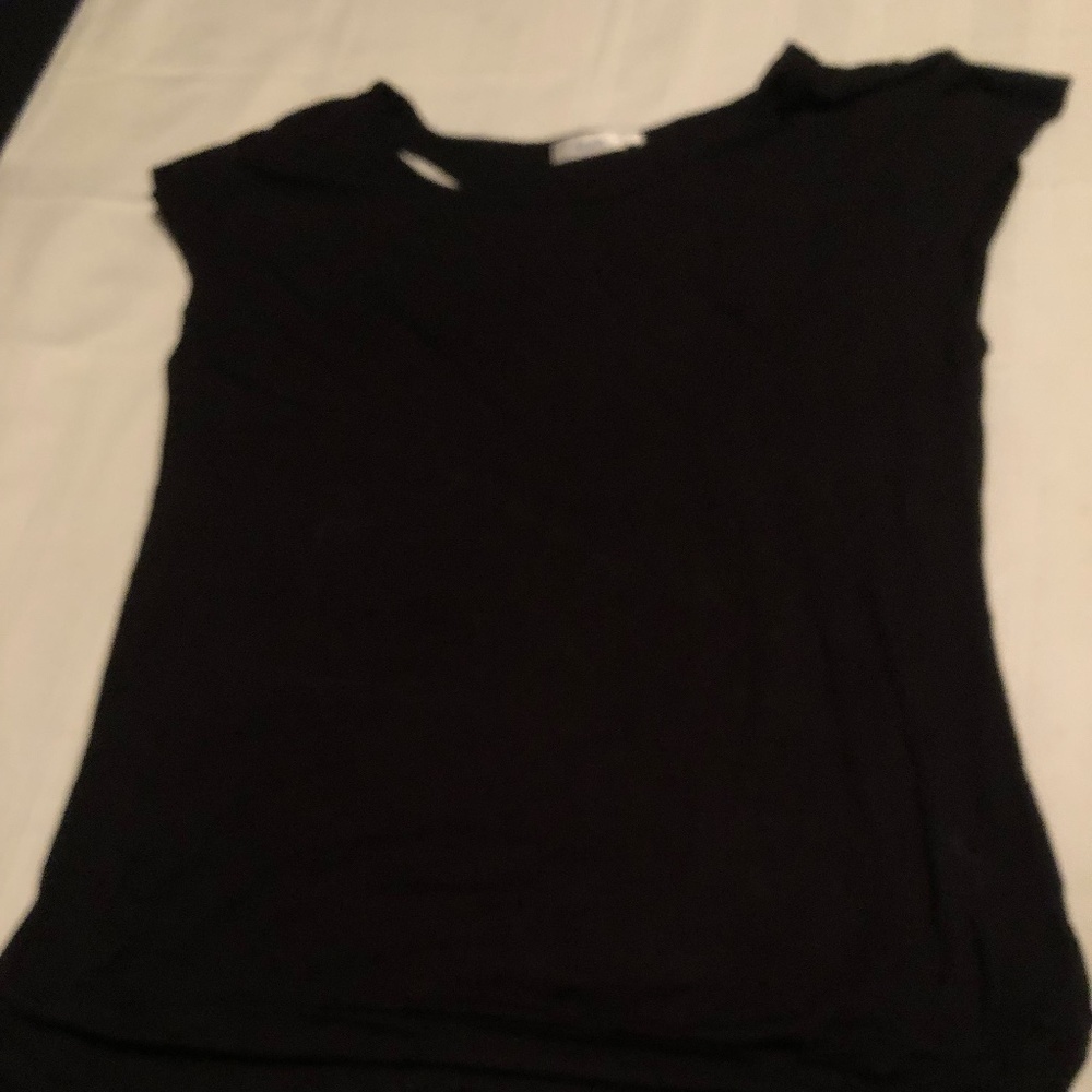 Ricki’s xl sleeveless top with sequins at back. Interesting looking top, new